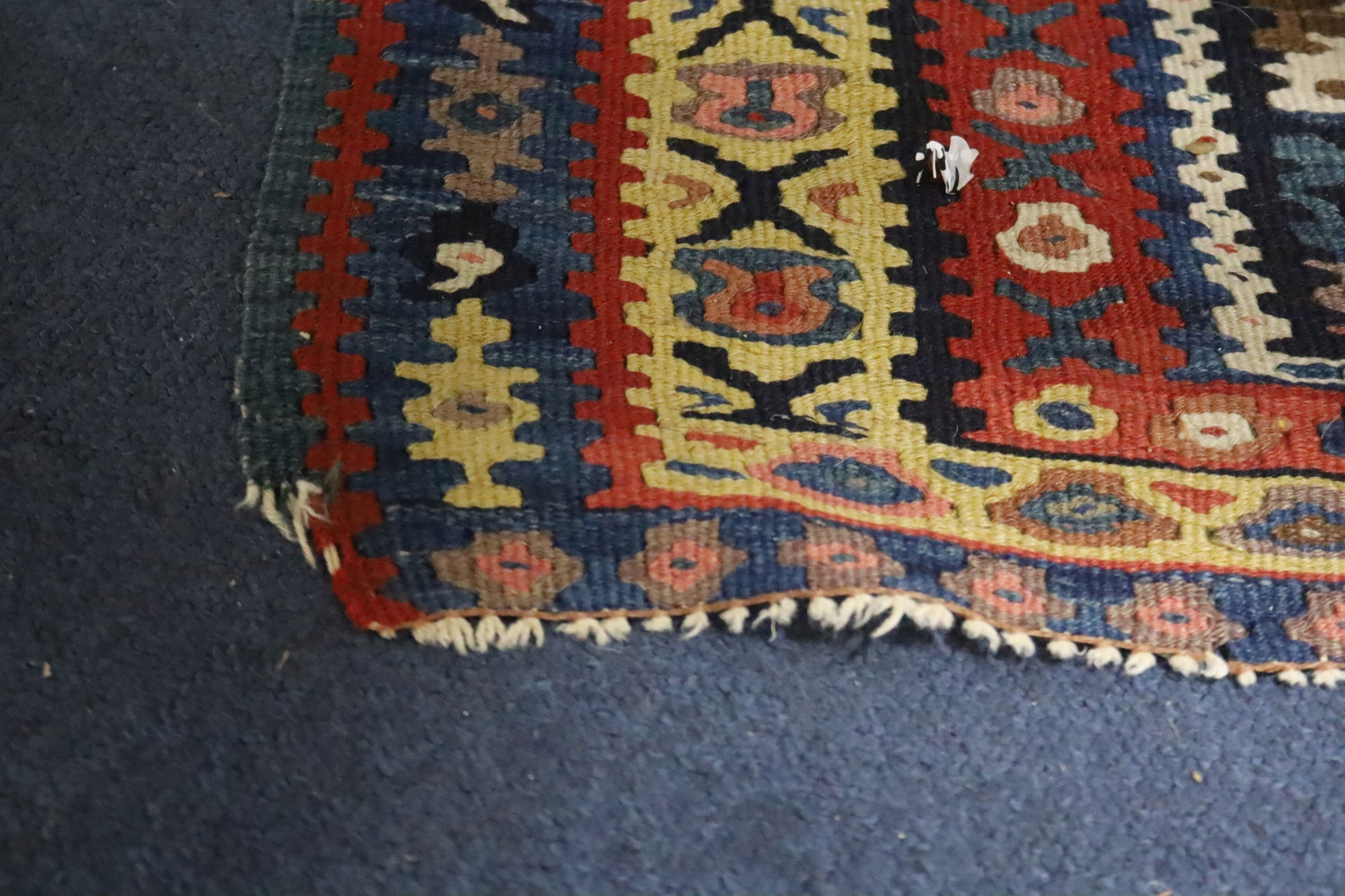 A late 19th century / early 20th century Senneh polychrome Kilim rug, 190 x 130cm